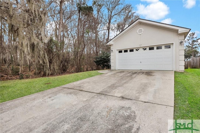 garage featuring a lawn