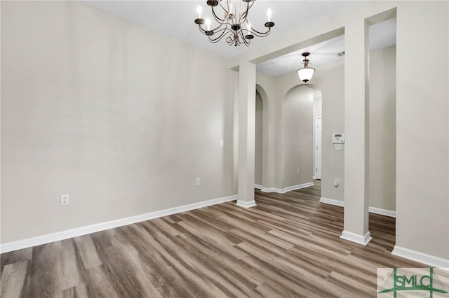 spare room featuring wood-type flooring