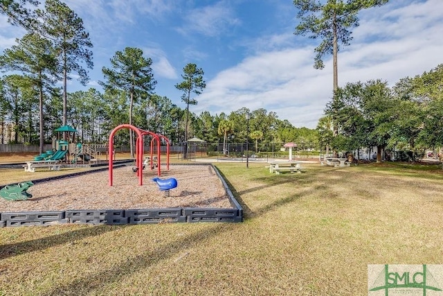 view of jungle gym featuring a lawn