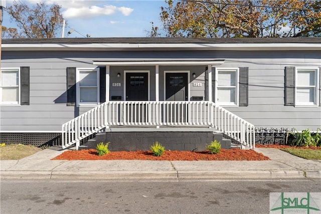 view of exterior entry featuring a porch