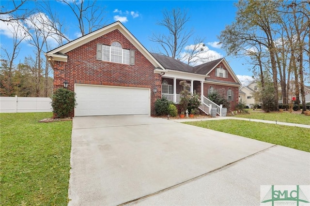 view of property featuring a garage and a front yard