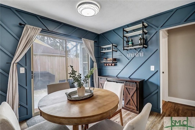 dining room with wood-type flooring