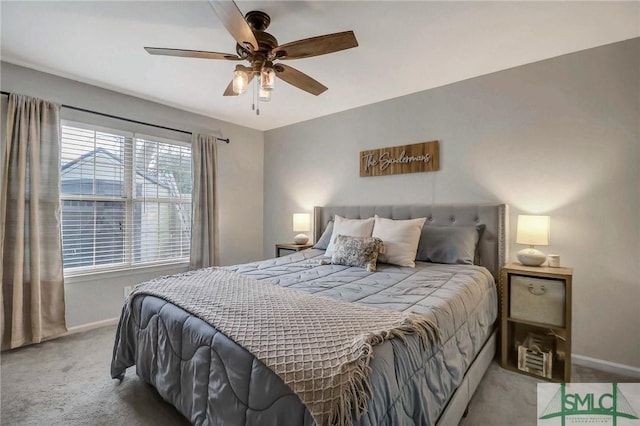 bedroom featuring light colored carpet and ceiling fan