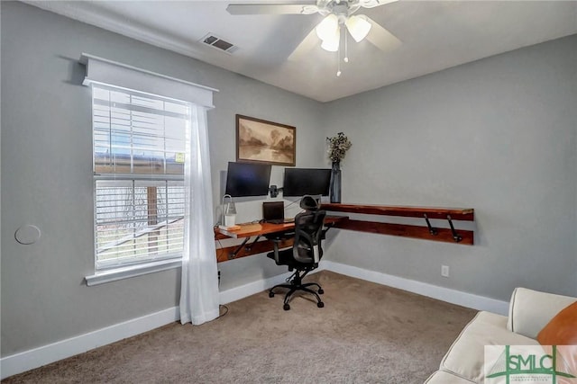 office space with light carpet and ceiling fan