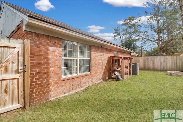 view of side of home featuring a yard