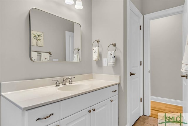 bathroom with tile patterned flooring and vanity