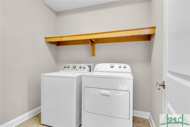 laundry area with washing machine and clothes dryer