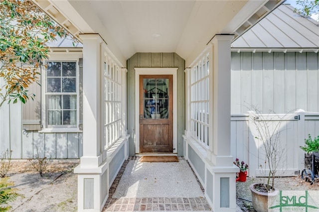 entrance to property featuring board and batten siding