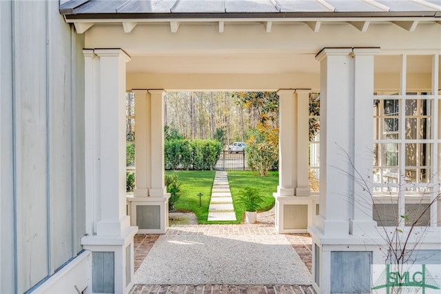 exterior space featuring decorative columns