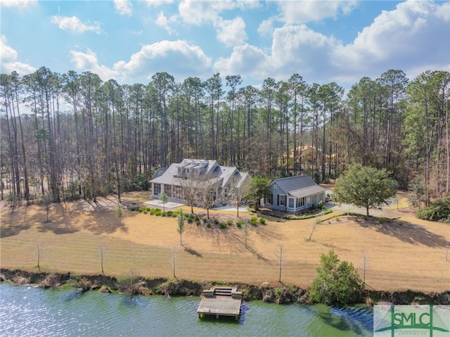 bird's eye view featuring a water view and a wooded view