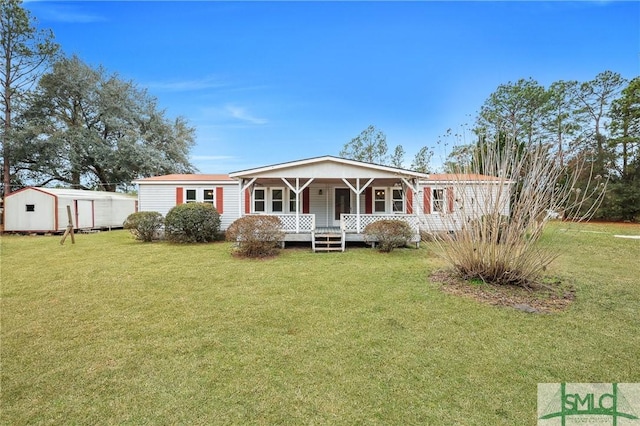 view of front of house with covered porch and a front yard