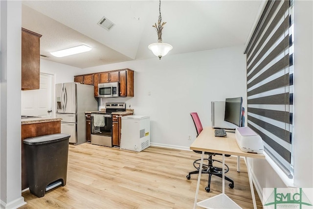 office space with light hardwood / wood-style floors