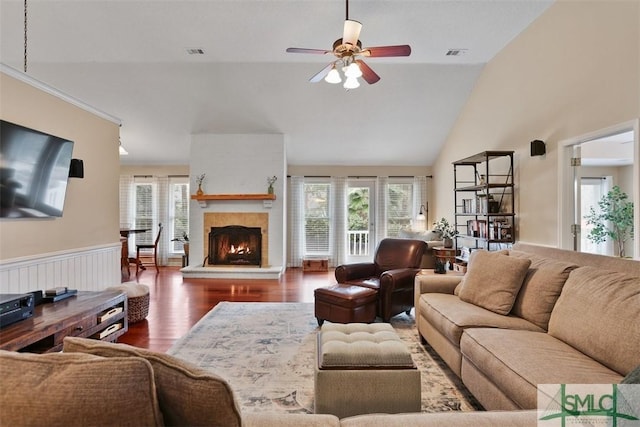 living room featuring ceiling fan, dark hardwood / wood-style floors, high vaulted ceiling, and a wealth of natural light