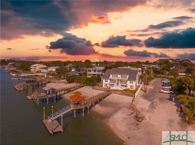 aerial view at dusk with a water view