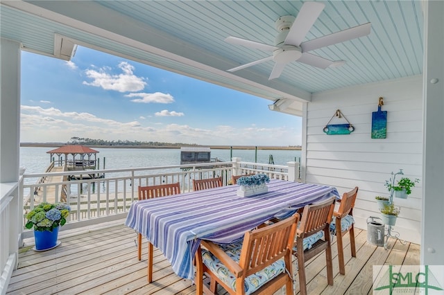 wooden terrace with a gazebo, a water view, and ceiling fan