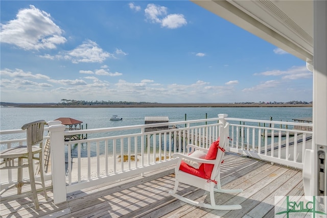 wooden terrace with a water view