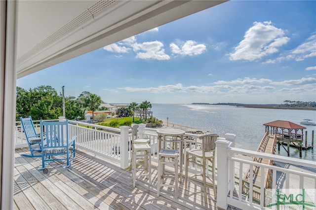 wooden deck with a water view