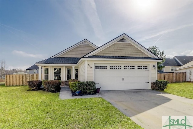 view of front of house with a garage and a front yard