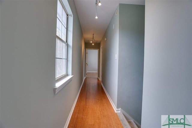 hall with light wood-type flooring