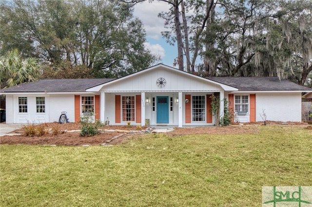 ranch-style home featuring a front yard