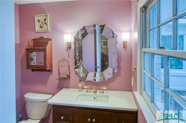 bathroom featuring vanity and toilet