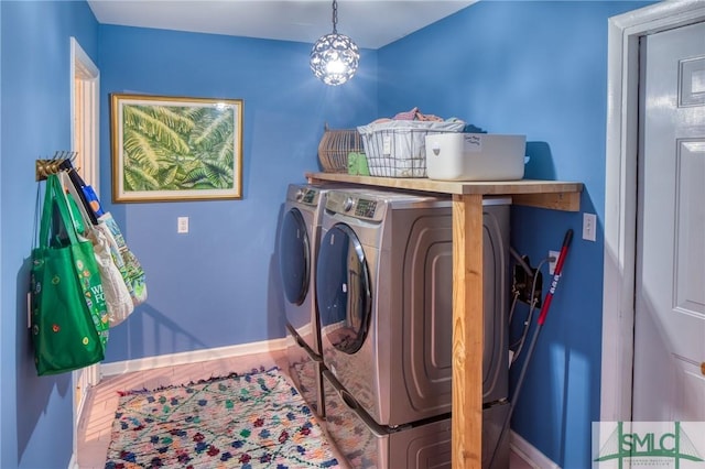 clothes washing area featuring washing machine and clothes dryer