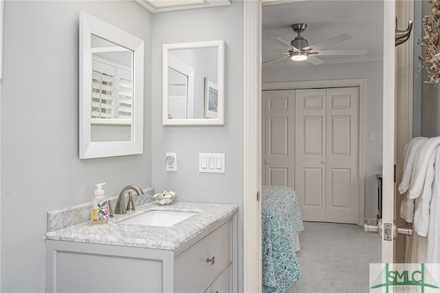 bathroom featuring vanity, ornamental molding, and ceiling fan