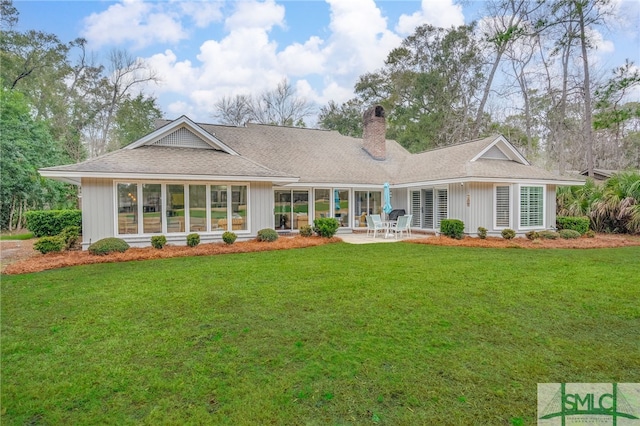 back of house featuring a yard and a patio