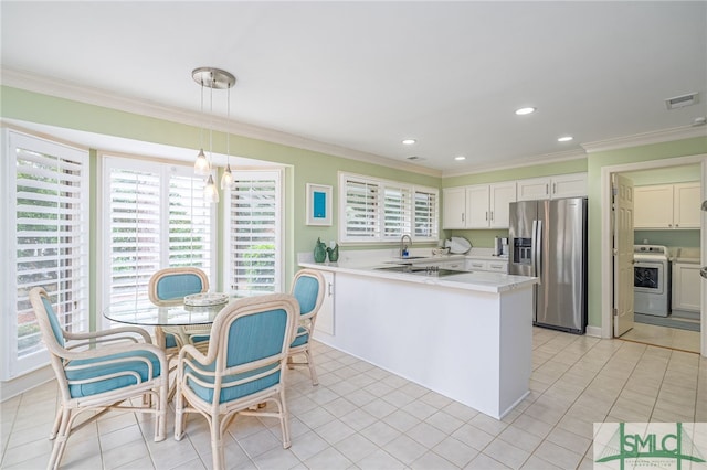 kitchen featuring crown molding, decorative light fixtures, stainless steel fridge with ice dispenser, white cabinets, and stove