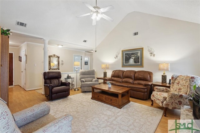 living room with high vaulted ceiling, decorative columns, ornamental molding, ceiling fan, and light hardwood / wood-style flooring