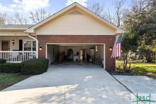 view of side of property featuring a porch and a garage