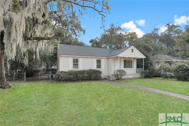 view of front of home featuring a front yard and covered porch