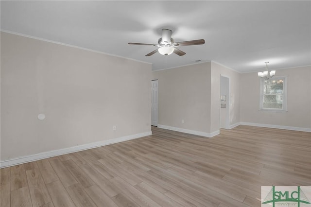 spare room featuring ornamental molding, ceiling fan with notable chandelier, and light wood-type flooring