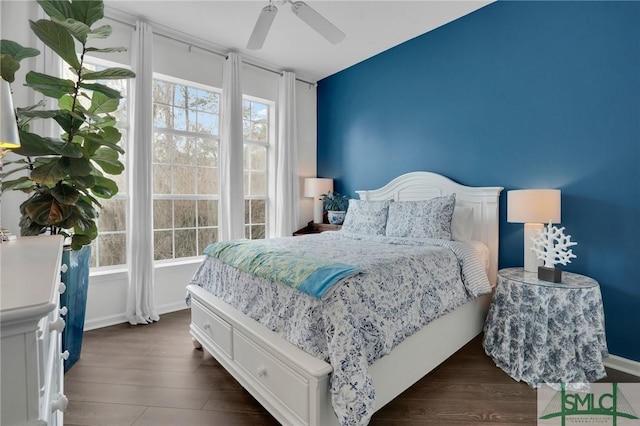 bedroom featuring dark hardwood / wood-style flooring and ceiling fan