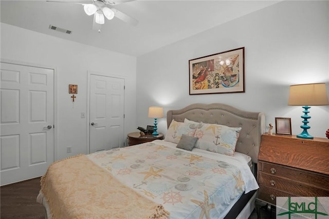 bedroom featuring ceiling fan and dark hardwood / wood-style flooring