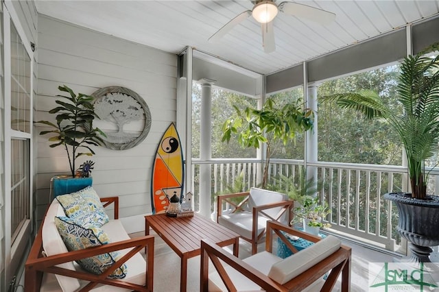 sunroom featuring ceiling fan