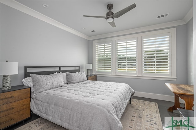 bedroom with multiple windows, crown molding, and ceiling fan