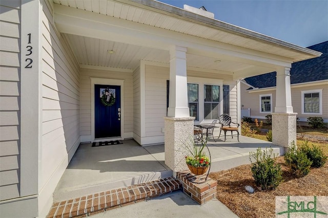 doorway to property featuring covered porch