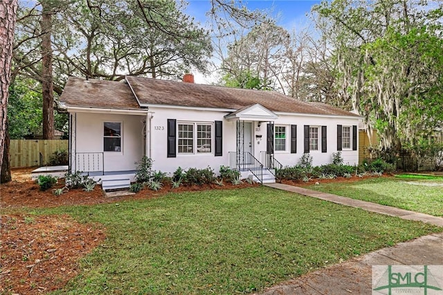 ranch-style house with a front lawn