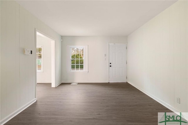 entryway with dark wood-type flooring