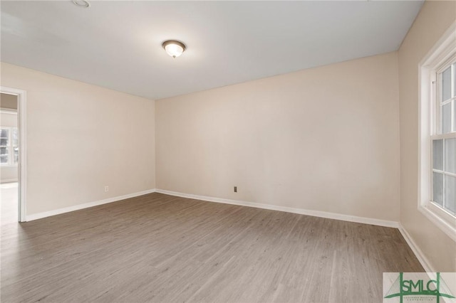 spare room with hardwood / wood-style flooring