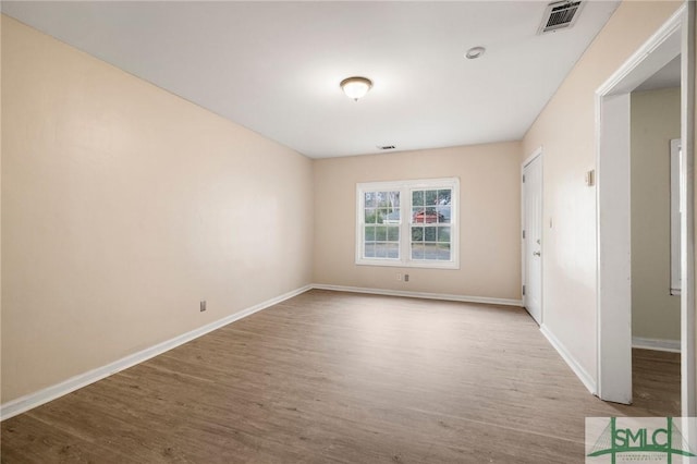 unfurnished room featuring light hardwood / wood-style floors