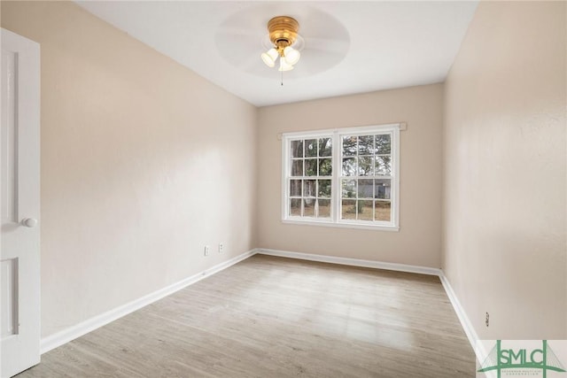 spare room featuring hardwood / wood-style floors and ceiling fan