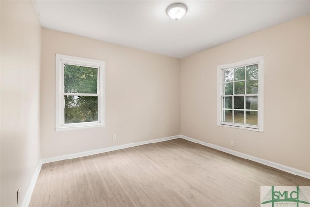 spare room featuring light hardwood / wood-style flooring