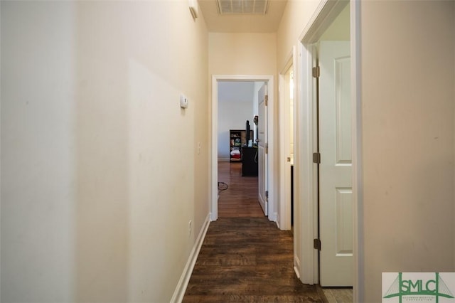 hallway featuring dark wood-type flooring