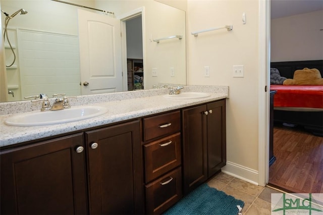 bathroom with tile patterned flooring and vanity