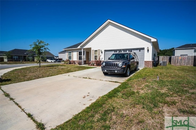 view of front facade featuring a garage, a front yard, and central air condition unit