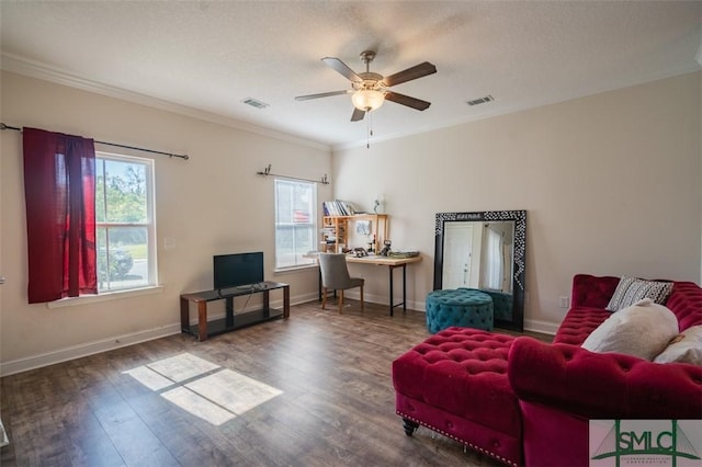 living area featuring crown molding, dark hardwood / wood-style floors, a textured ceiling, and ceiling fan