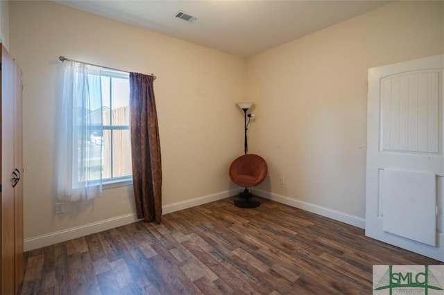 unfurnished room with dark hardwood / wood-style floors