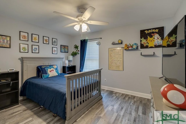 bedroom with ceiling fan and hardwood / wood-style floors